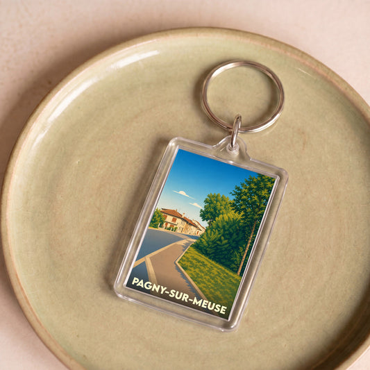 Porte-clés souvenir de la ville de Pagny-sur-Meuse avec une illustration stylisée.