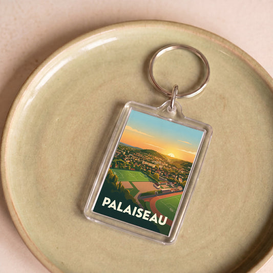 Porte-clés souvenir de la ville de Palaiseau orné d'une illustration stylisée de son paysage urbain.