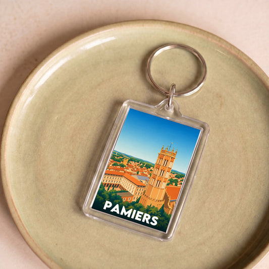 Porte-clés souvenir de la ville de Pamiers avec une illustration stylisée.