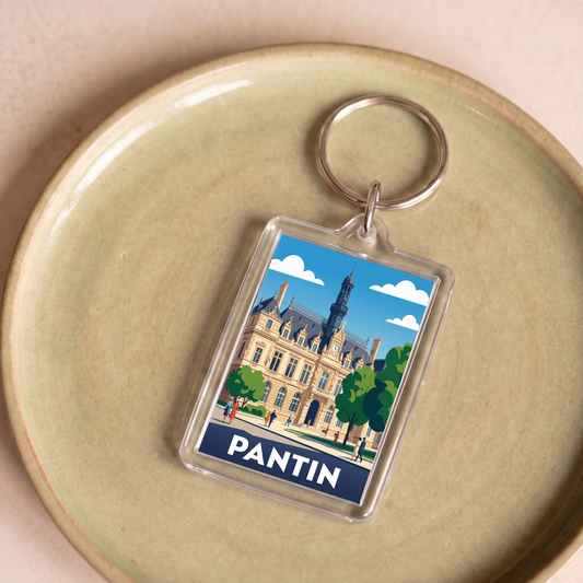 Porte-clés souvenir de la ville de Pantin avec une illustration stylisée de son hôtel de ville.