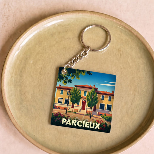 Porte-clés souvenir de la ville de Parcieux avec une illustration stylisée.