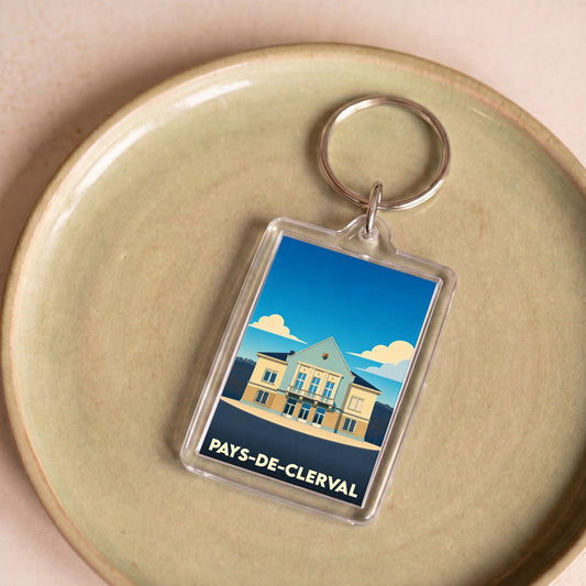Porte-clés souvenir de la ville de Pays-de-Clerval avec une illustration stylisée de l'hôtel de ville.
