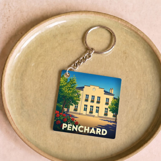Porte-clés souvenir de la ville de Penchard avec une illustration stylisée de sa mairie.