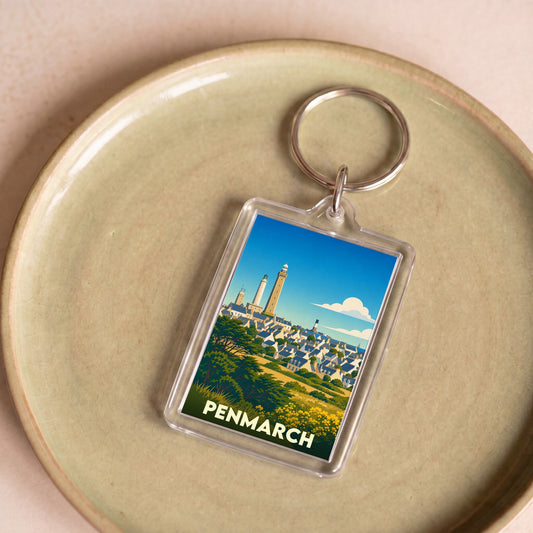 Porte-clés souvenir de la ville de Penmarch avec une illustration stylisée de son phare et de ses côtes.