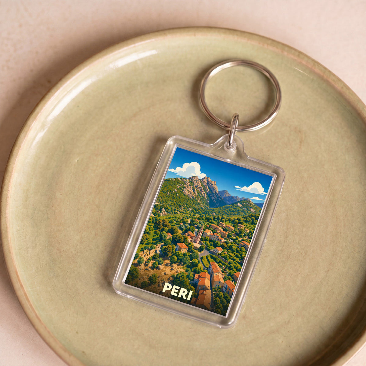 Porte-clés souvenir de la ville de Peri avec une illustration stylisée.
