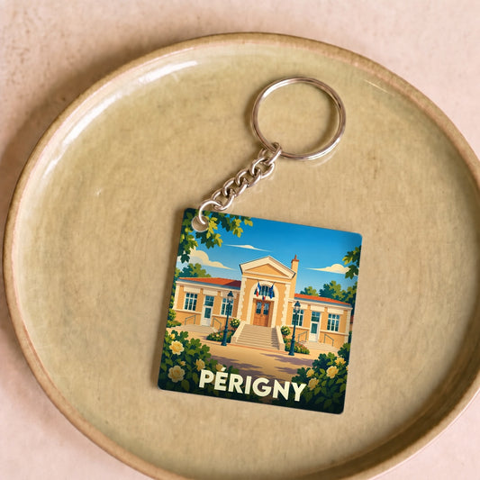 Porte-clés souvenir de la ville de Périgny avec une illustration stylisée de son hôtel de ville.