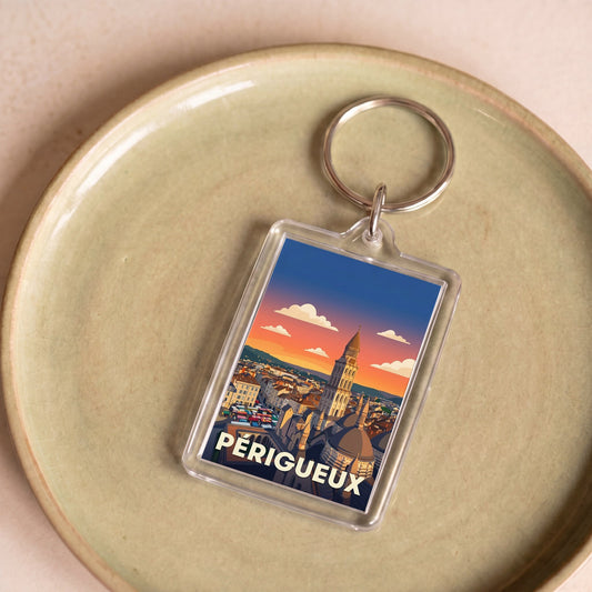 Porte-clés souvenir de la ville de Périgueux avec une illustration stylisée.