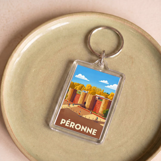 Porte-clés souvenir de la ville de Péronne avec une illustration stylisée.