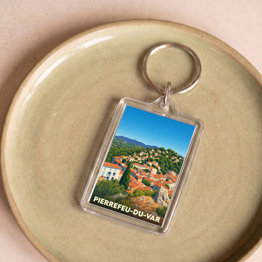 Porte-clés souvenir de la ville de Pierrefeu-du-Var avec une illustration stylisée.
