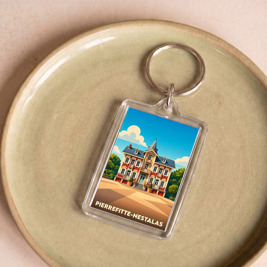 Porte-clés souvenir de la ville de Pierrefitte-Nestalas avec une illustration stylisée.