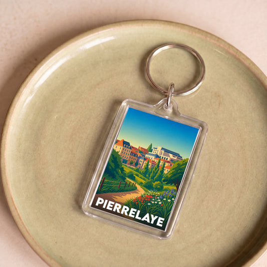 Porte-clés souvenir de la ville de Pierrelaye avec une illustration stylisée.