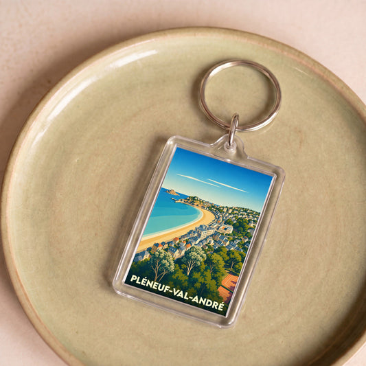 Porte-clés souvenir de la ville de Pléneuf-Val-André avec une illustration stylisée.