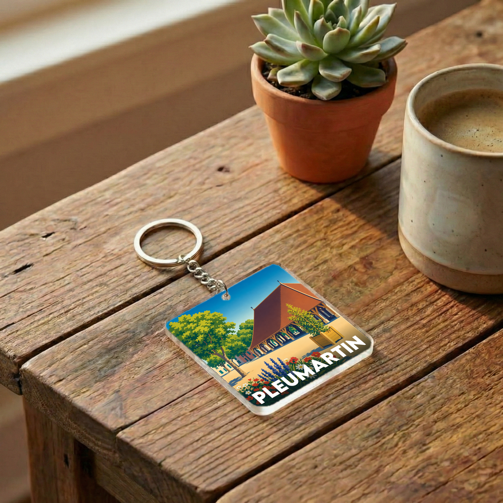 Porte-clés souvenir de la ville de Pleumartin avec une illustration stylisée.