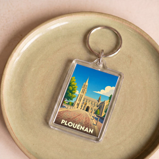 Porte-clés souvenir de la ville de Plouénan avec une illustration stylisée.