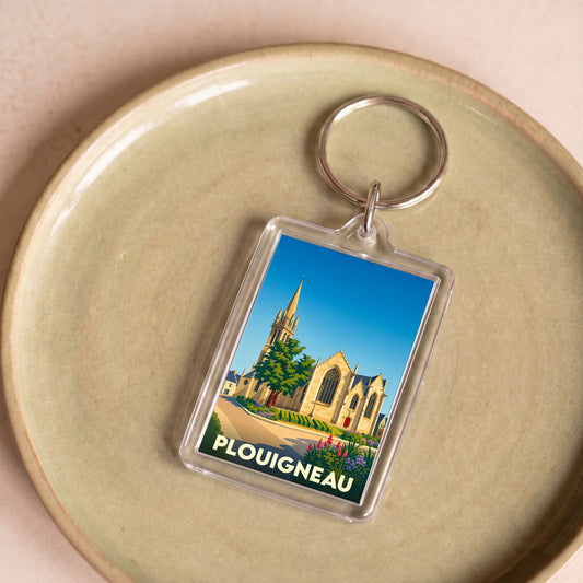 Porte-clés souvenir de la ville de Plouigneau avec une illustration stylisée de son église.