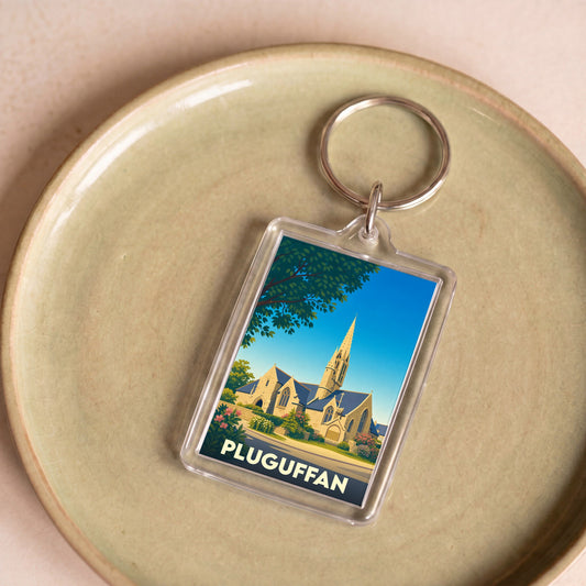 Porte-clés souvenir de la ville de Pluguffan avec une illustration stylisée de son église.