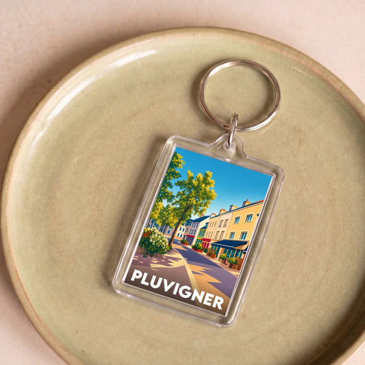 Porte-clés souvenir de la ville de Pluvigner avec une illustration colorée et stylisée.