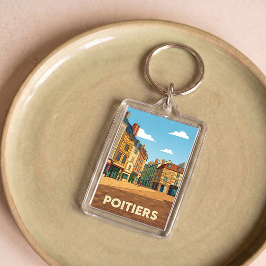 Porte-clés souvenir de la ville de Poitiers avec une illustration stylisée.