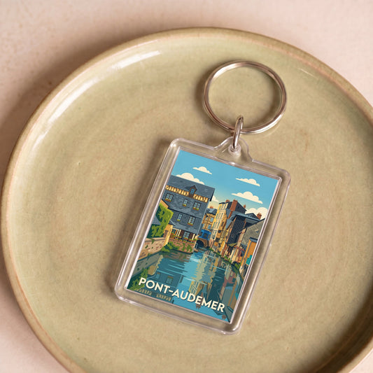 Porte-clés souvenir de la ville de Pont-Audemer avec une illustration stylisée.