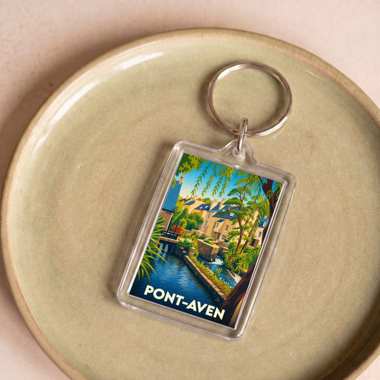 Porte-clés souvenir de la ville de Pont-Aven avec une illustration colorée et stylisée de ses canaux.