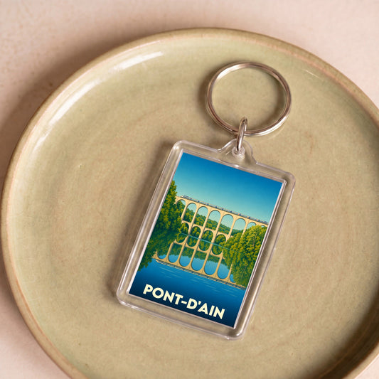 Porte-clés souvenir de la ville de Pont-d'Ain avec une illustration stylisée de son viaduc.