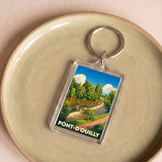Porte-clés souvenir de la ville de Pont-d'Ouilly avec une illustration stylisée.