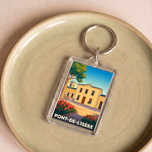 Porte-clés souvenir de la ville de Pont-de-l'Isère avec une illustration stylisée de sa mairie.
