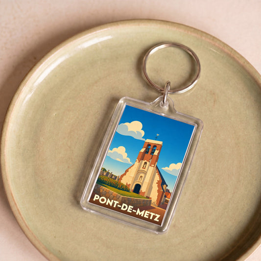 Porte-clés souvenir de la ville de Pont-de-Metz avec une illustration stylisée de son église.