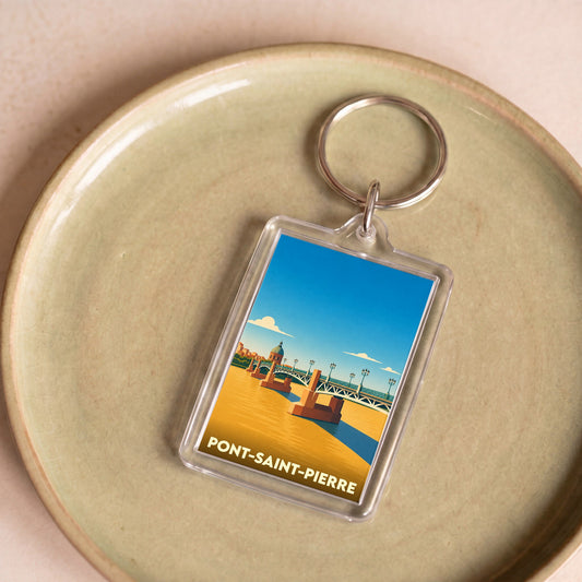 Porte-clés souvenir de la ville de Pont-Saint-Pierre avec une illustration stylisée du pont et de son dôme.