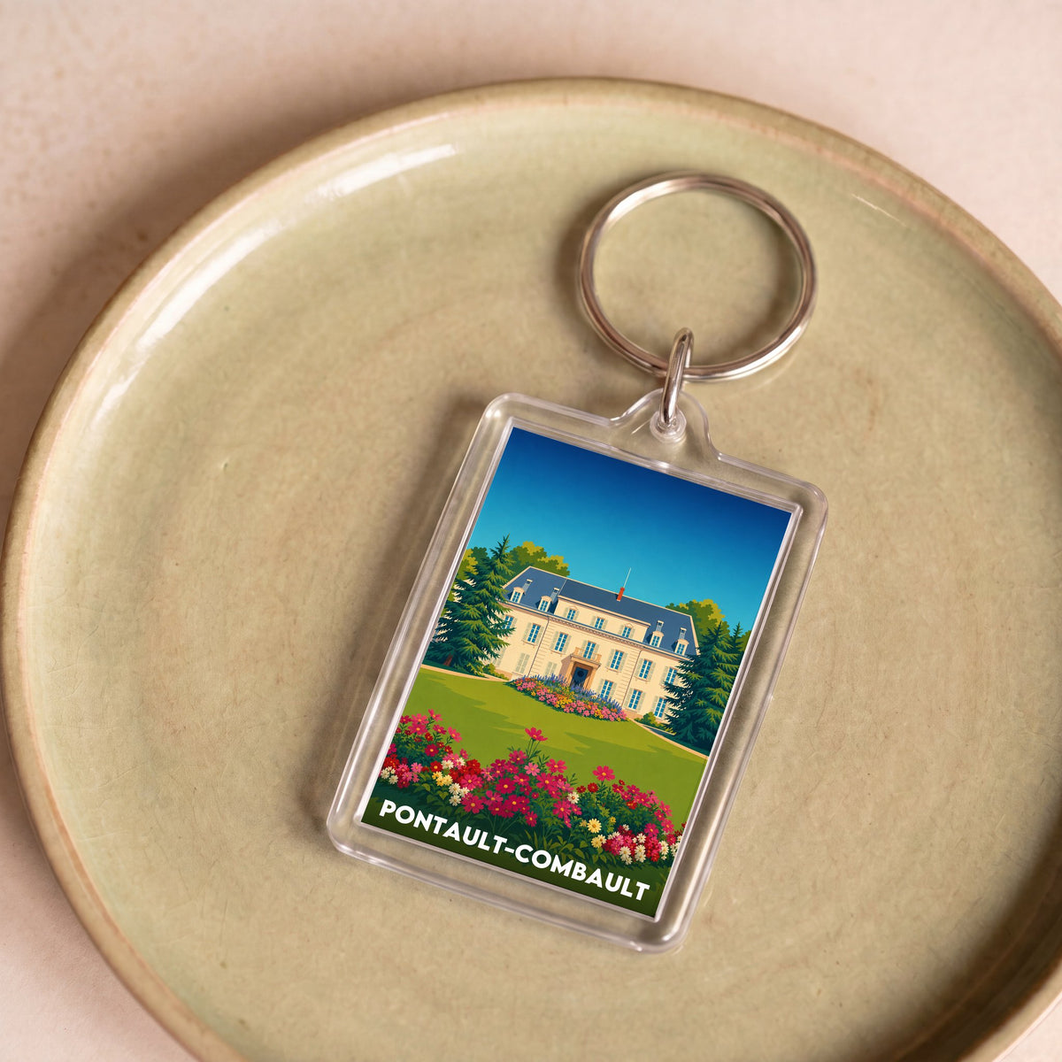 Porte-clés souvenir de la ville de Pontault-Combault avec une illustration stylisée.