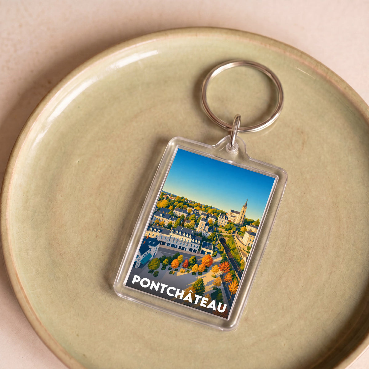Porte-clés souvenir de la ville de Pontchâteau avec une illustration stylisée.