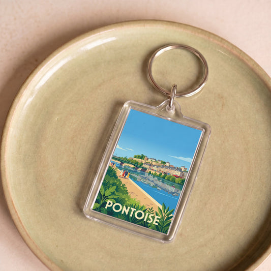 Porte-clés souvenir de la ville de Pontoise avec une illustration stylisée et colorée.
