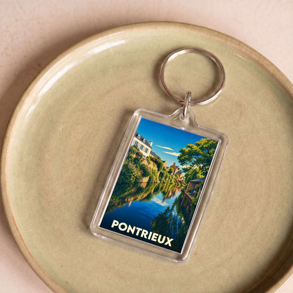 Porte-clés souvenir de la ville de Pontrieux avec une illustration stylisée de ses canaux.