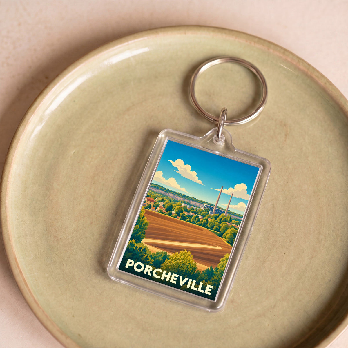 Porte-clés souvenir de la ville de Porcheville avec une illustration stylisée.
