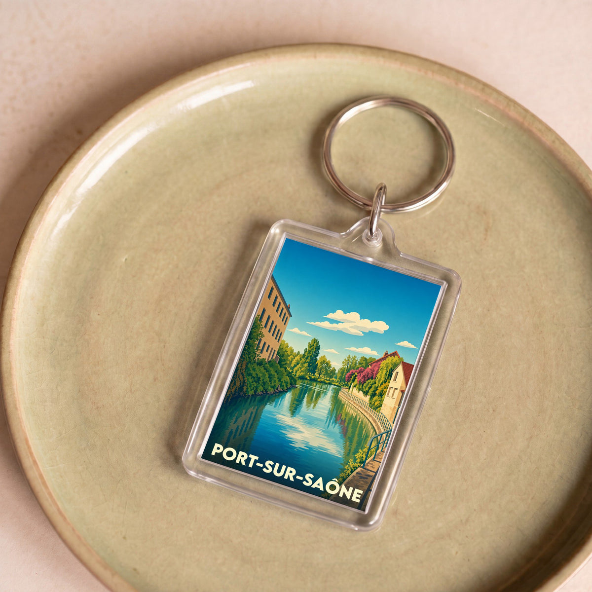 Porte-clés souvenir de la ville de Port-sur-Saône avec une illustration stylisée.