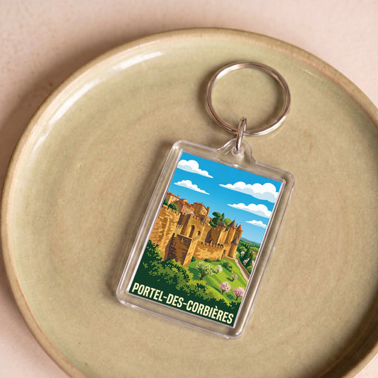 Porte-clés souvenir de la ville de Portel-des-Corbières avec une illustration stylisée.
