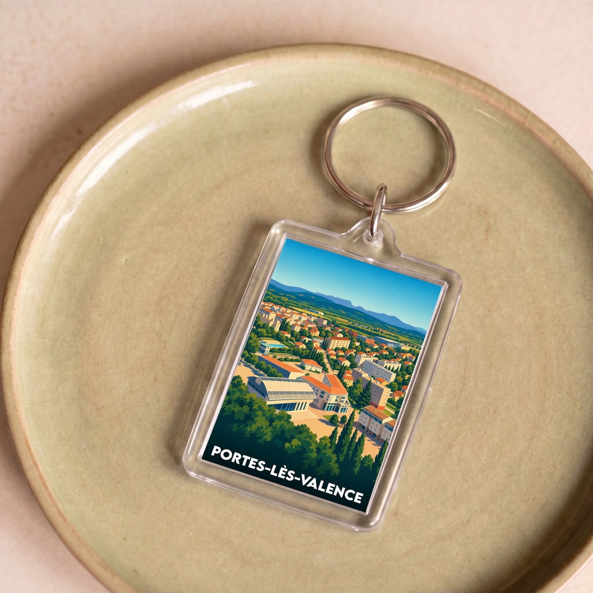 Porte-clés souvenir de la ville de Portes-lès-Valence avec une illustration panoramique stylisée.