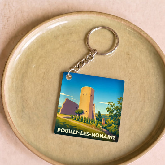 Porte-clés souvenir de la ville de Pouilly-les-Nonains avec une illustration stylisée.