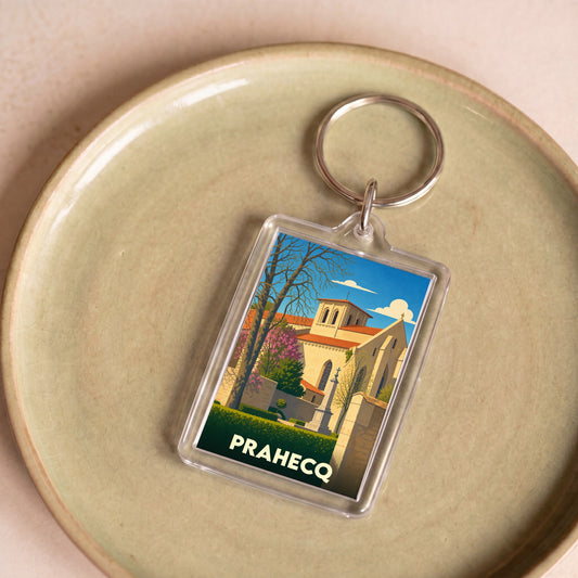 Porte-clés souvenir de la ville de Prahecq avec une illustration stylisée de son église.
