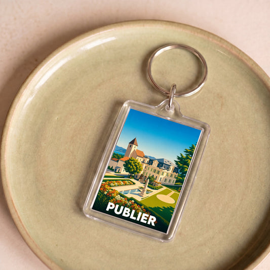 Porte-clés souvenir de la ville de Publier avec une illustration stylisée de son architecture.