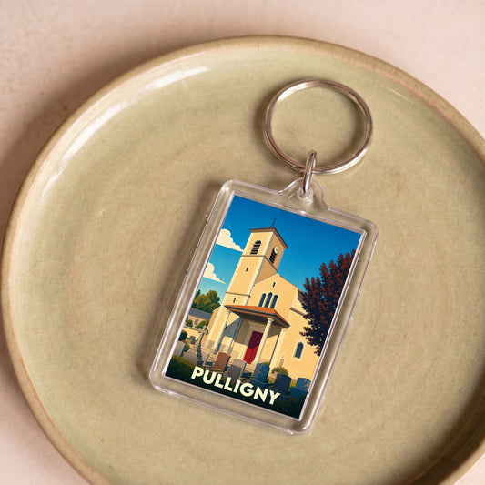 Porte-clés souvenir de la ville de Pulligny avec une illustration stylisée de son église.