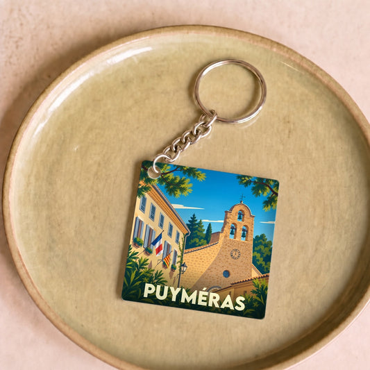 Porte-clés souvenir de la ville de Puyméras avec une illustration stylisée.