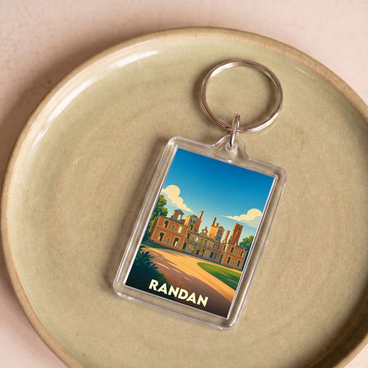 Porte-clés souvenir de la ville de Randan avec une illustration stylisée de son château.