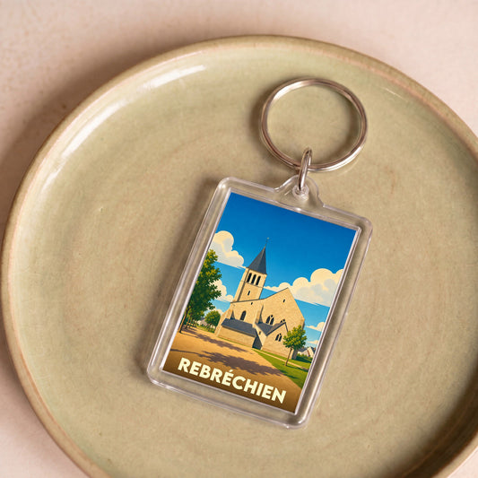 Porte-clés souvenir de la ville de Rebréchien avec une illustration stylisée de son église.