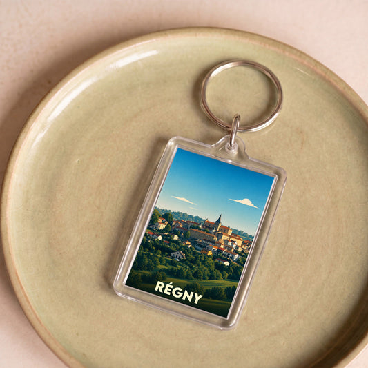 Porte-clés souvenir de la ville de Régny avec une illustration stylisée.