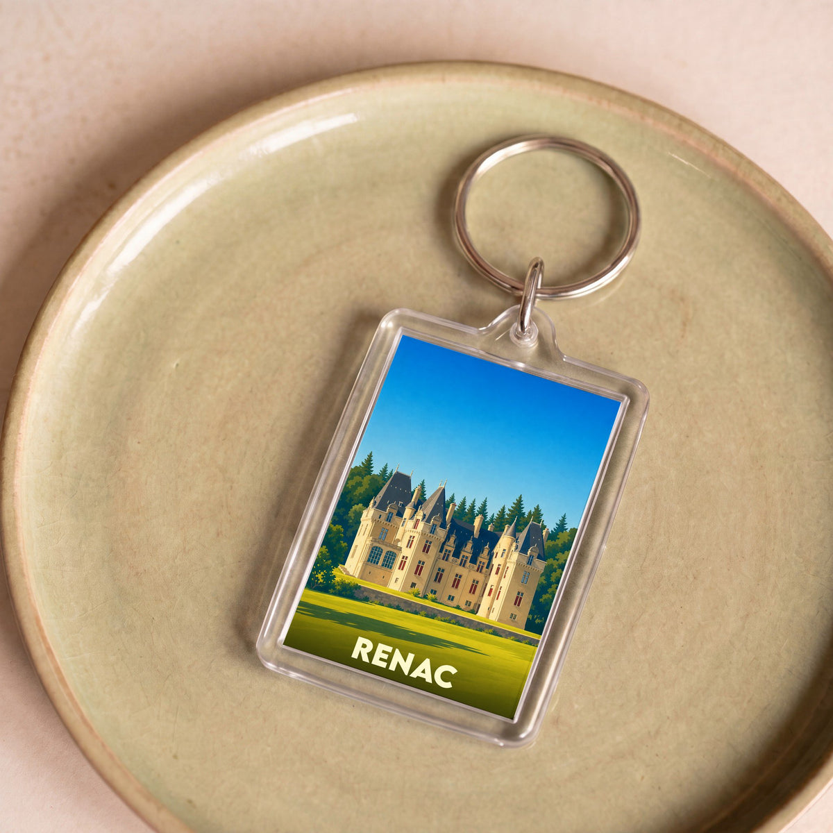 Porte-clés souvenir de la ville de Renac avec une illustration stylisée de son château.