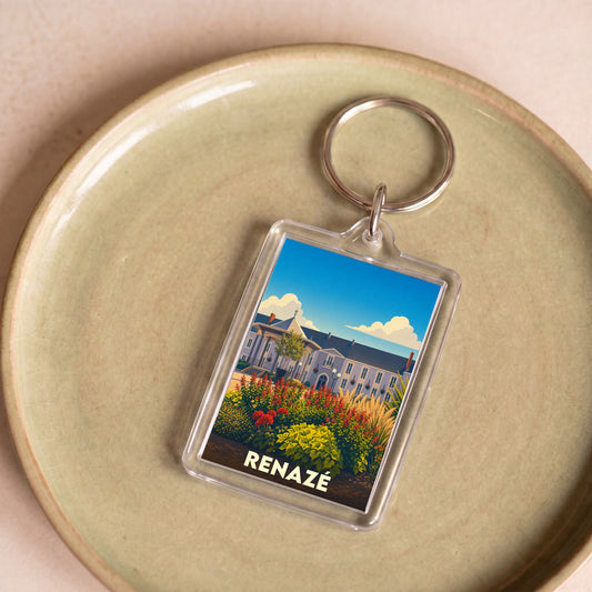 Porte-clés souvenir de la ville de Renazé avec une illustration stylisée d'un bâtiment fleuri.