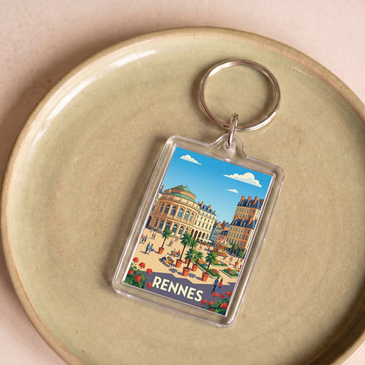 Porte-clés souvenir de la ville de Rennes avec une illustration stylisée et colorée.