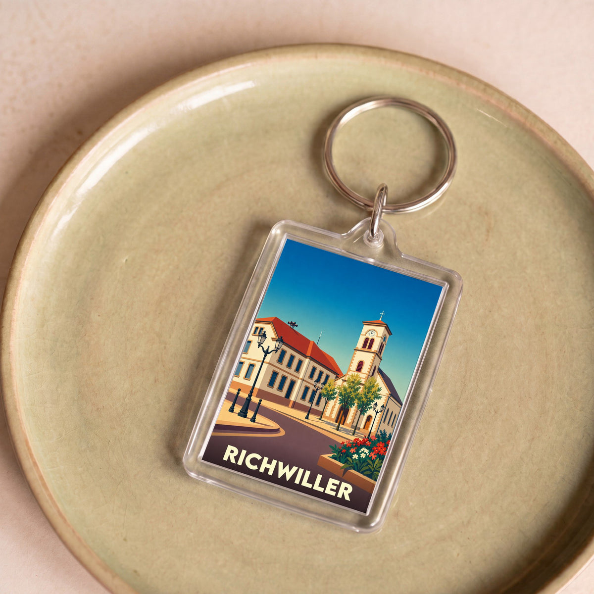 Porte-clés souvenir de la ville de Richwiller avec une illustration stylisée.