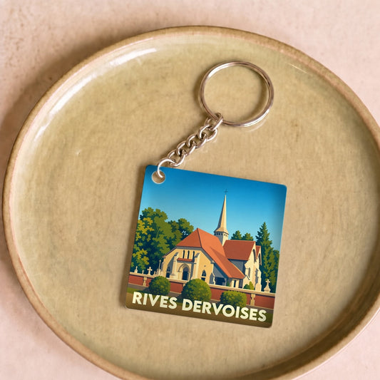 Porte-clés souvenir de la ville de Rives Dervoises avec une illustration stylisée d'une église.